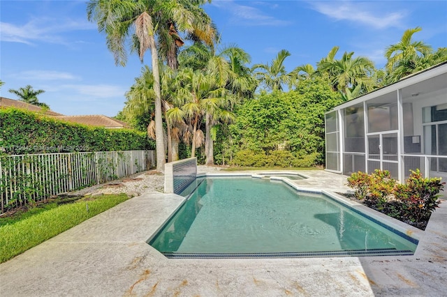 view of pool featuring a sunroom