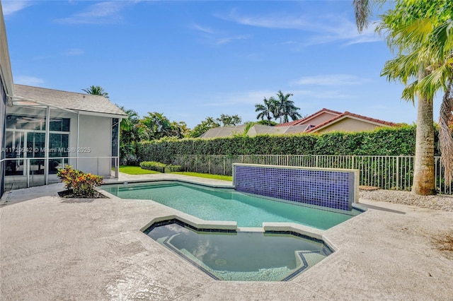 view of swimming pool with an in ground hot tub and a patio area