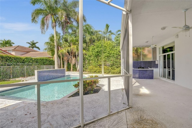 view of pool with a patio area and ceiling fan