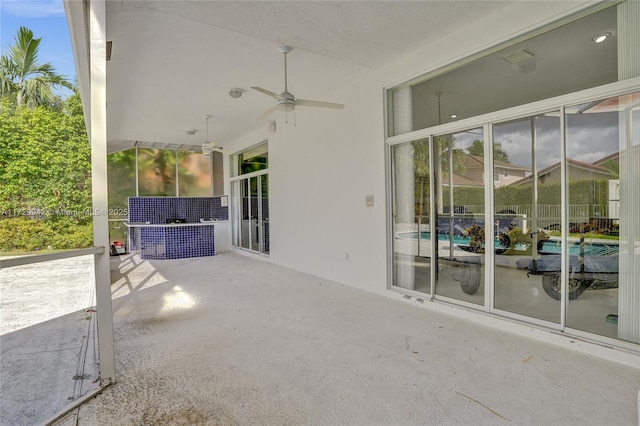 view of patio / terrace featuring ceiling fan