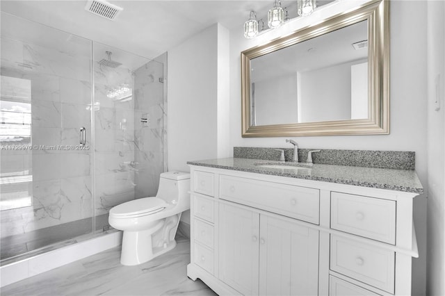 bathroom with toilet, walk in shower, and vanity