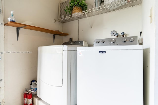 laundry room featuring washer and dryer and laundry area