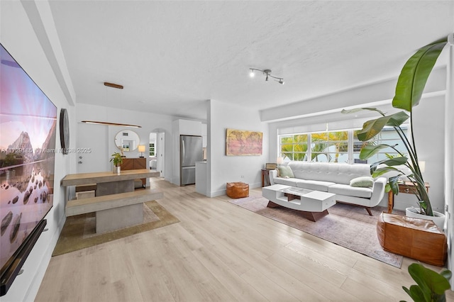 living room with light hardwood / wood-style flooring