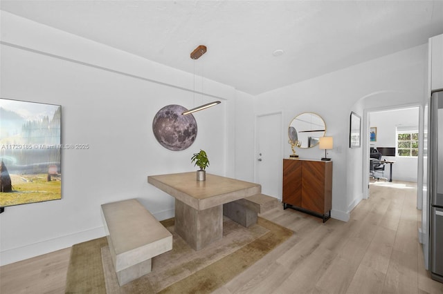 dining area featuring light wood-type flooring