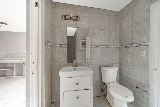 bathroom featuring vanity, toilet, and tile patterned floors