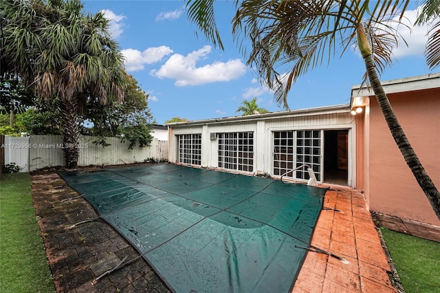 view of pool with french doors