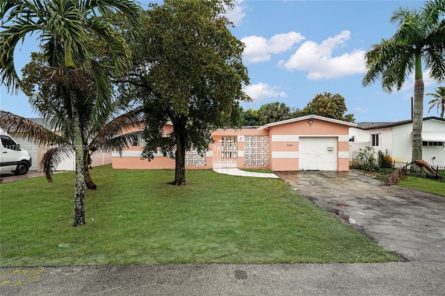 single story home with a garage and a front yard