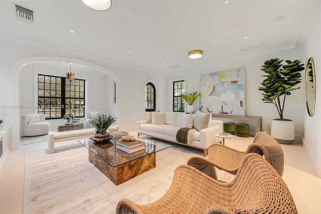 living room featuring crown molding and a healthy amount of sunlight