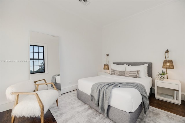 bedroom featuring hardwood / wood-style flooring