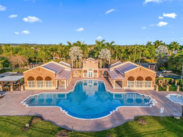 outdoor pool featuring a patio area