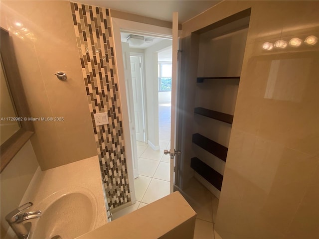 bathroom with sink and tile patterned flooring