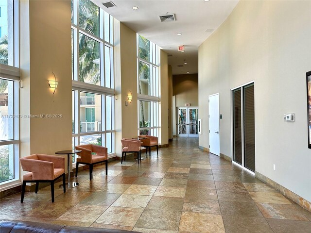 1755 E Hallandale Beach Blvd Unit 1605E, Hallandale Beach, FL 33009 - common area featuring a towering ceiling