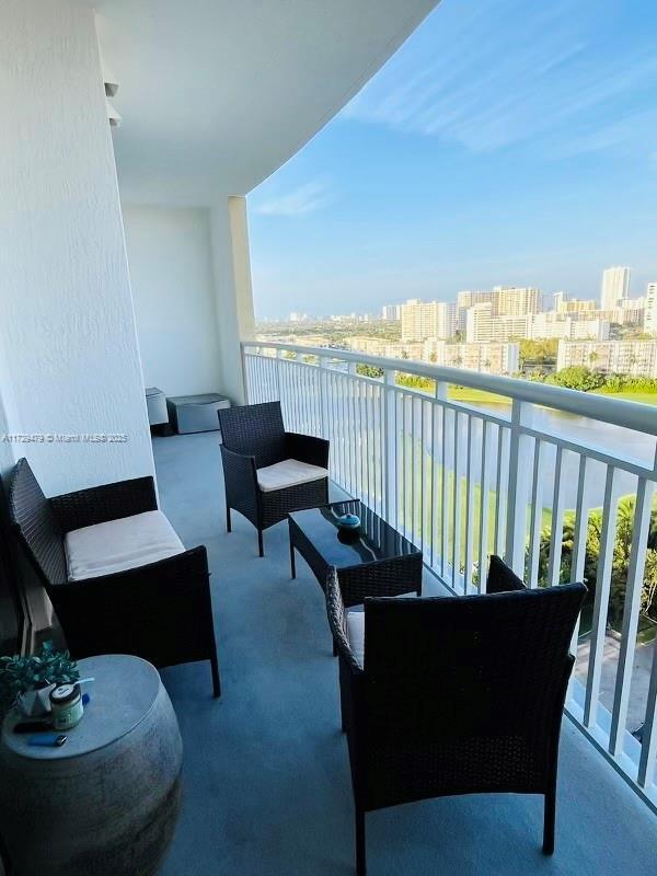 1755 E Hallandale Beach Blvd Unit 1605E, Hallandale Beach, FL 33009 - balcony with a city view, a water view, and outdoor lounge area