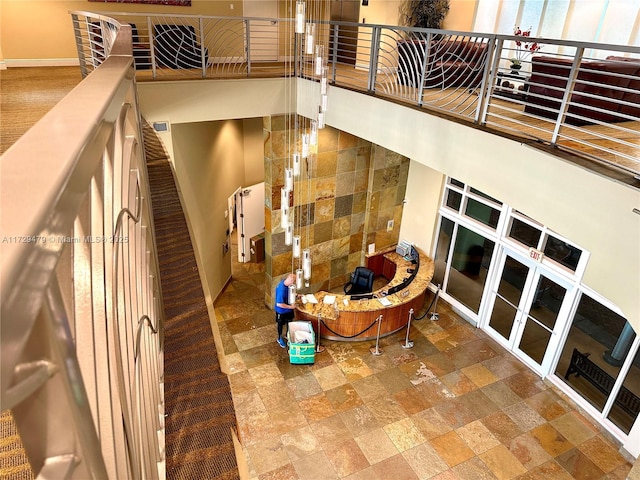staircase featuring stone finish flooring