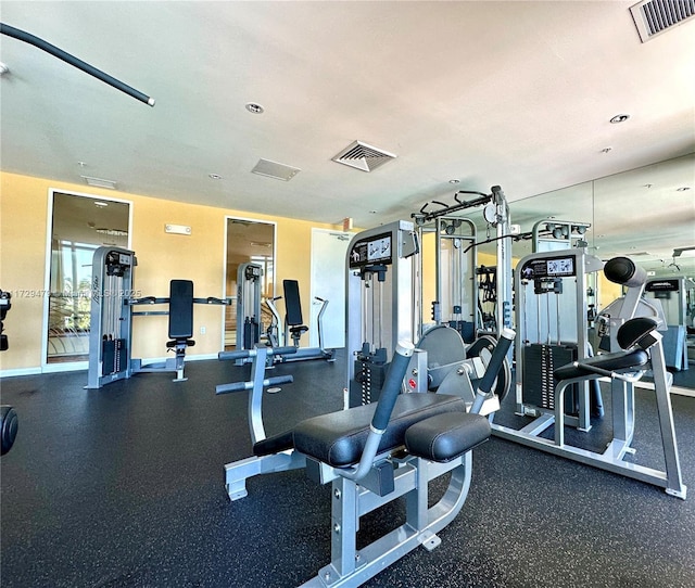 workout area with baseboards and visible vents