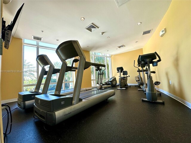 workout area with baseboards and visible vents
