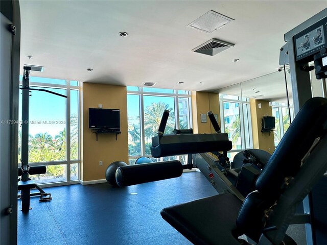 1755 E Hallandale Beach Blvd Unit 1605E, Hallandale Beach, FL 33009 - gym with baseboards, plenty of natural light, and recessed lighting
