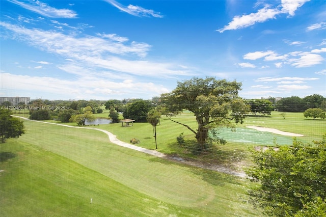 view of community with a lawn and a water view