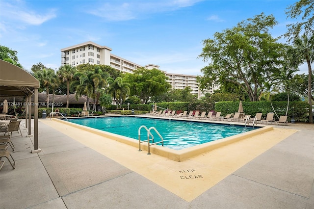 view of swimming pool with a patio