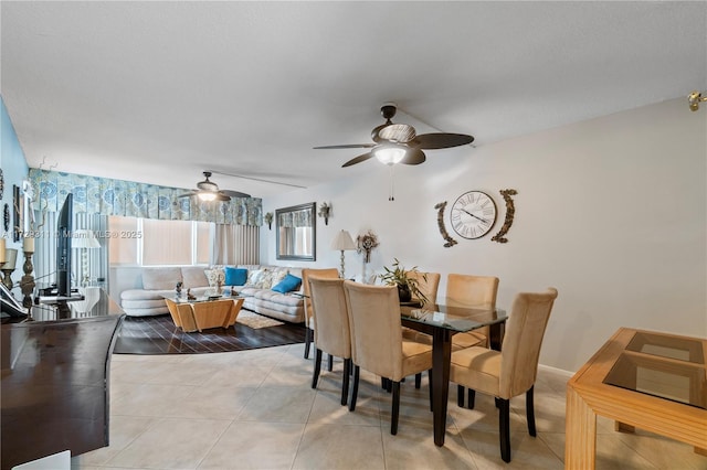 tiled dining room with ceiling fan