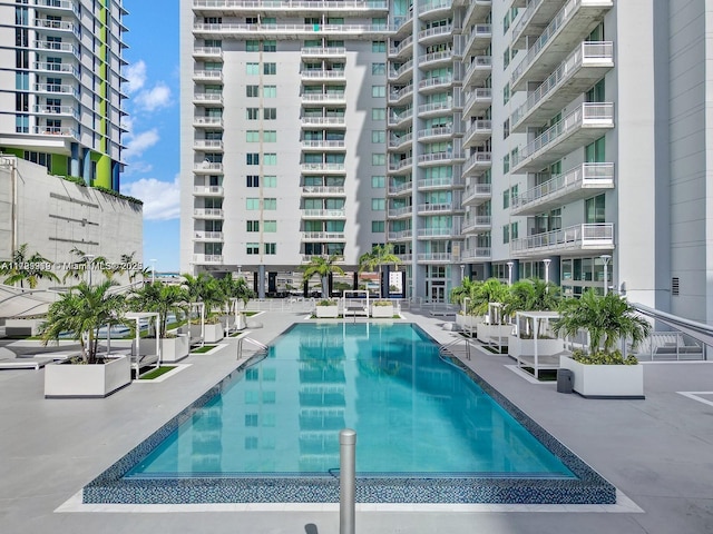 view of swimming pool with a patio area