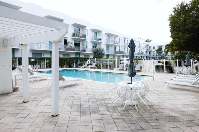 view of swimming pool featuring a pergola