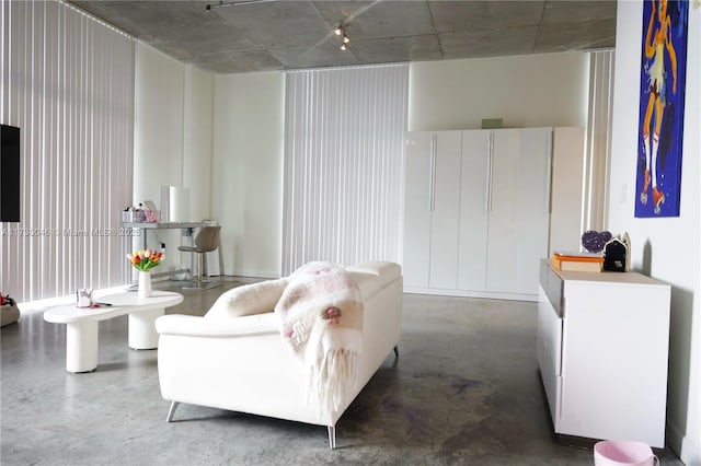 living room featuring concrete floors