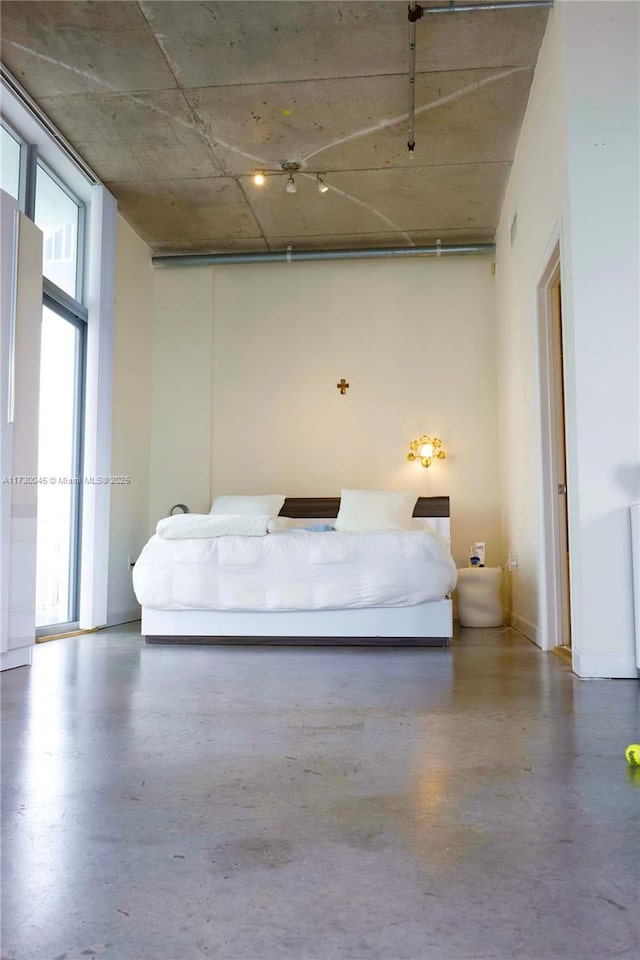 unfurnished bedroom featuring concrete floors