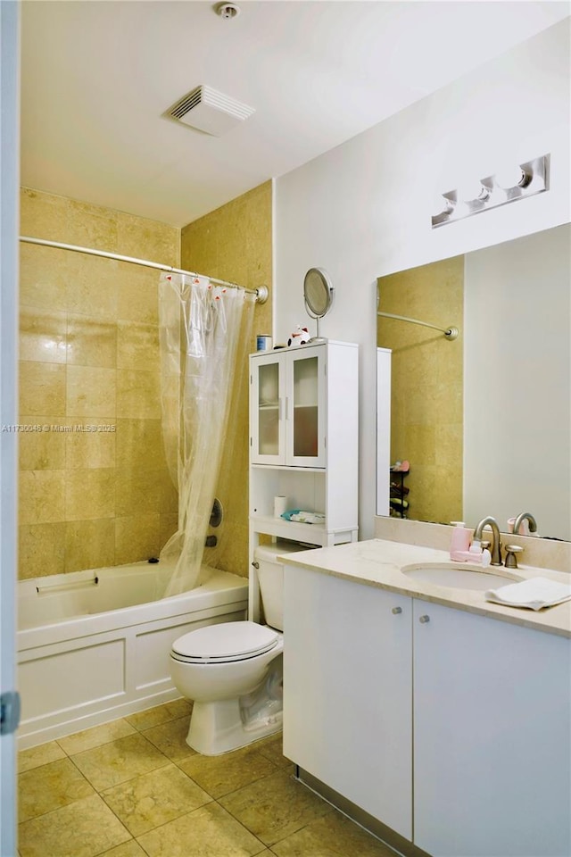 full bathroom featuring tile patterned floors, vanity, toilet, and shower / tub combo