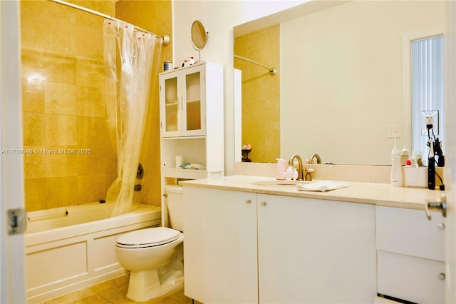 full bathroom featuring tile patterned flooring, shower / bath combo, vanity, and toilet