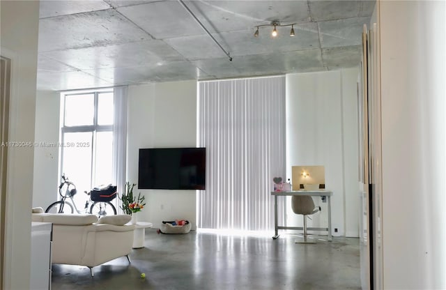 living room featuring concrete floors