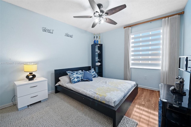 bedroom featuring a textured ceiling and ceiling fan