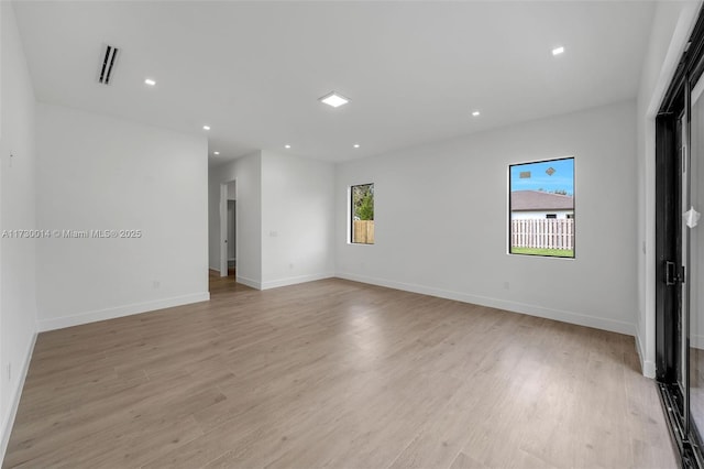 unfurnished room featuring light hardwood / wood-style flooring