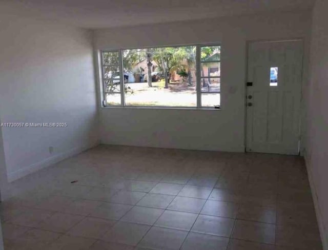 foyer entrance with tile patterned flooring