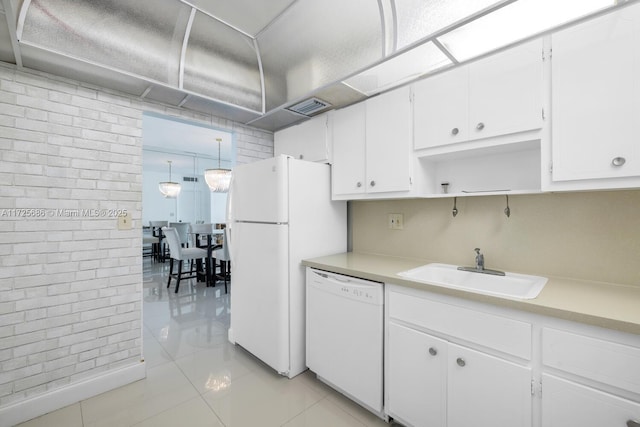 kitchen with sink, white cabinetry, white appliances, and light tile patterned flooring