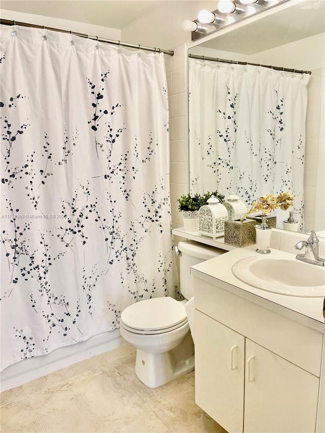 full bathroom with vanity, toilet, and shower / tub combo with curtain