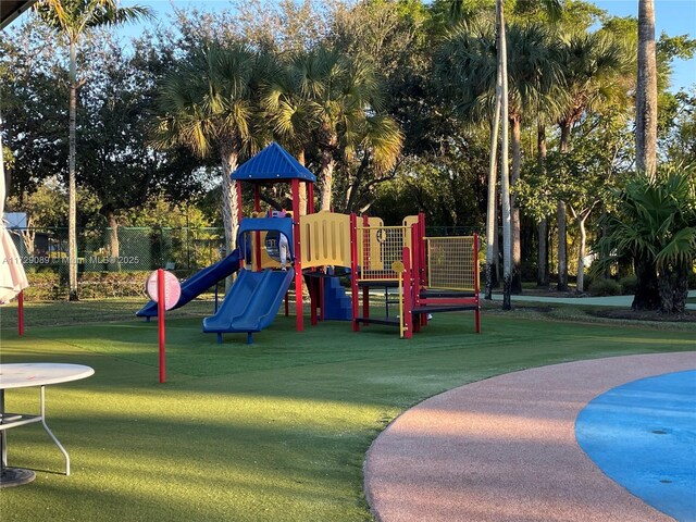 view of playground with a yard