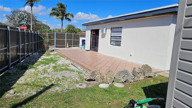 view of yard with a fenced backyard and a patio