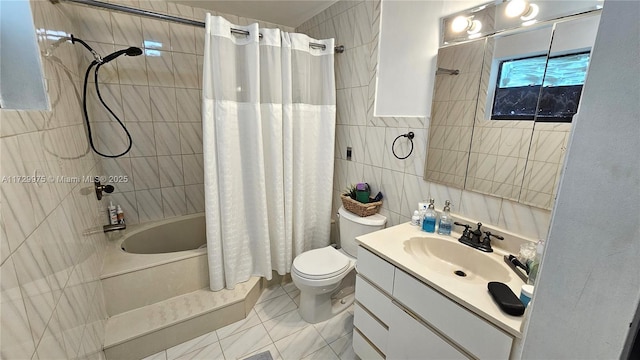 full bath with toilet, tile walls, shower / bath combination with curtain, and vanity