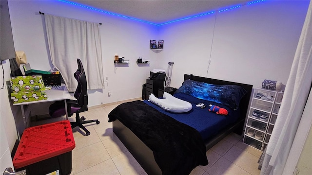 bedroom with tile patterned floors