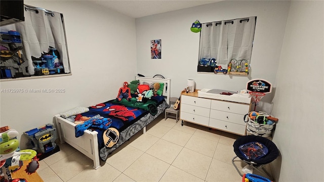 bedroom featuring light tile patterned flooring