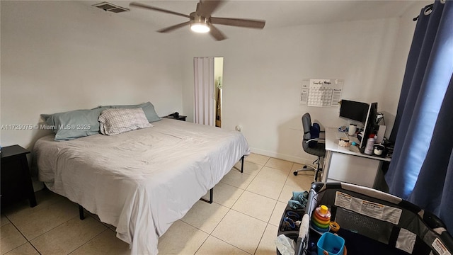 bedroom featuring a ceiling fan, light tile patterned flooring, visible vents, and baseboards