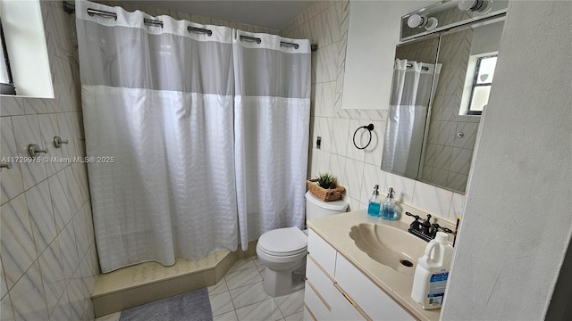 full bath with tile walls, toilet, and vanity