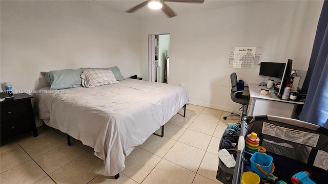 bedroom featuring light tile patterned floors, ceiling fan, and baseboards