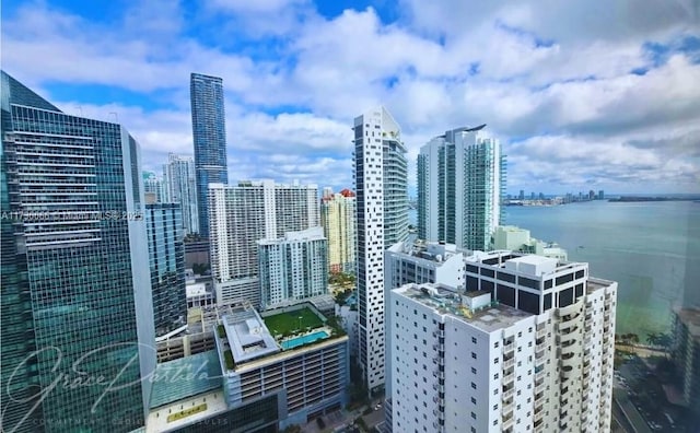 property's view of city featuring a water view