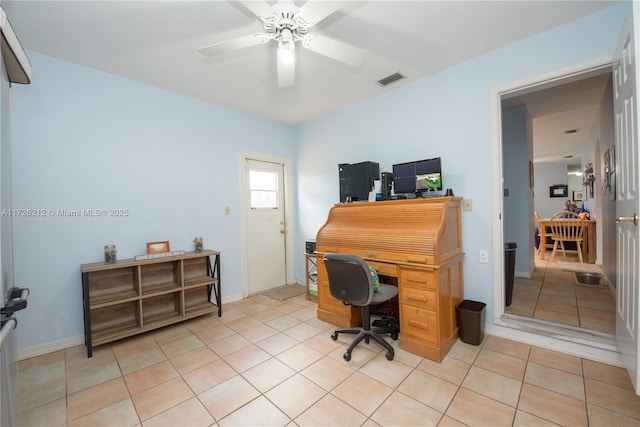 home office with ceiling fan and light tile patterned flooring