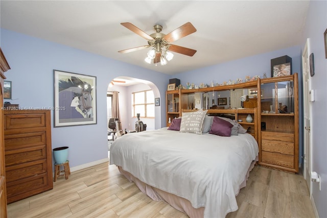 bedroom with light hardwood / wood-style flooring and ceiling fan