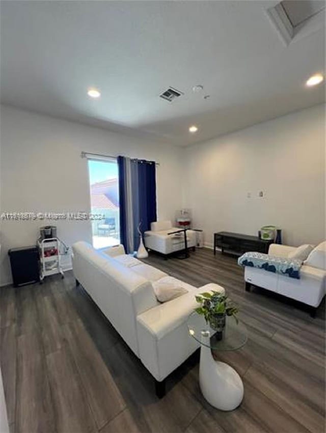 living room with dark hardwood / wood-style floors