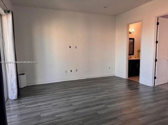 empty room featuring dark hardwood / wood-style floors