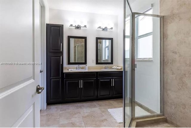 bathroom with walk in shower and vanity